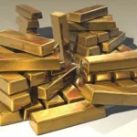 Ouro brilha na turbulência: XP explica como investir no metal que desafia as crises